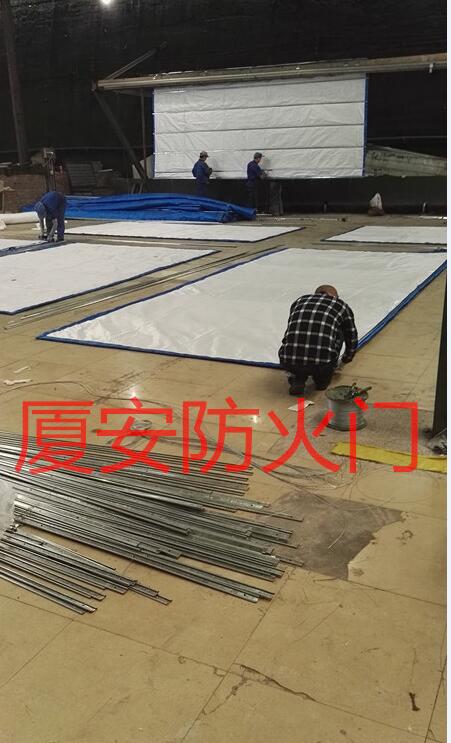 1568103529105569.jpg 防火卷簾簾布生產(chǎn)車間.jpg